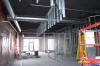 April 11, 2008 - Wall framing and ducting continues.  Soffit framing over espresso bar begins.